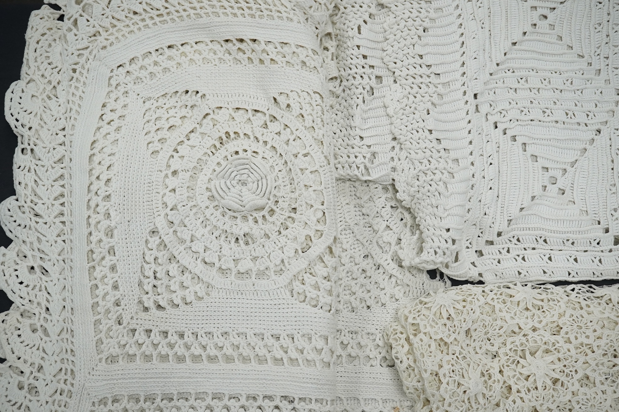 Three Edwardian thick white crochet bed covers, one made from squares with raised crochet flowers to the centres, another cover plainer and the other with loose crochet. 212cm x 166cm. Condition - all appear in good cond